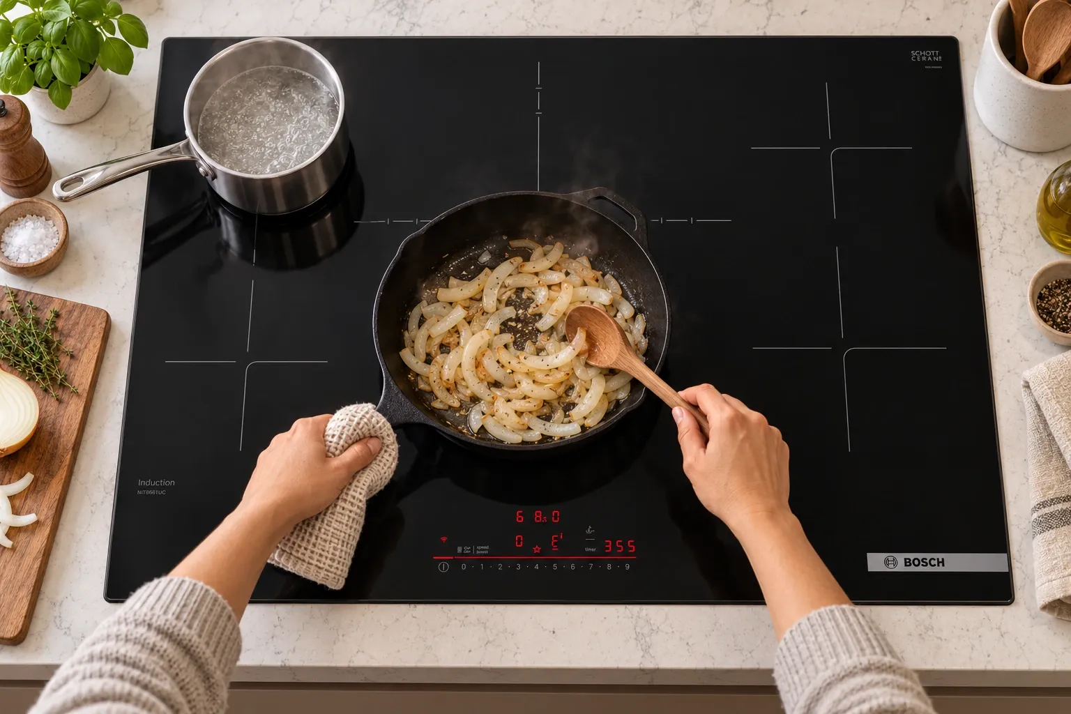 Onions in a cast-iron skillet beside a boiling pot on a Bosch 800 Series NIT8661UC.
